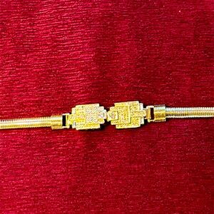 Gold metal dress belt with rhinestone (?) buckle
